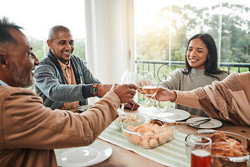 Image showing Wine, food and toast with family at dining table for party, celebration and holiday. Lunch, happy and success with group of people and cheers with glass at home for event, support or dinner together