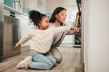 Image showing Oven, teaching and parent cooking with child in kitchen for development, care and learning a recipe together at home. Stove, curious and kid help mom or mother prepare food, meal or baking in house