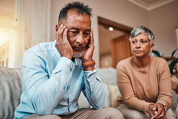 Image showing Conflict, senior couple and fight on couch, divorce and depression with a breakup, cheating and stress. Sad, elderly woman and old man with mental health, home and separation with crisis and angry