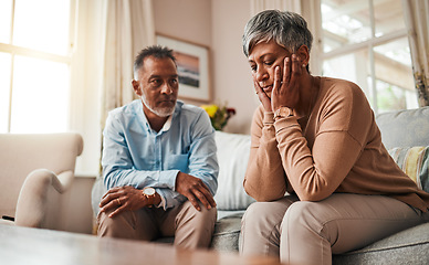 Image showing Fight, senior couple and divorce on sofa, stress and conflict with a breakup, depression and home. Angry, old woman or elderly man with mental health, cheating or sad with separation, fail or mistake