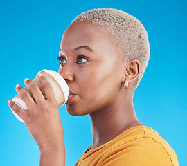 Image showing Thinking, drink or black woman with coffee on blue background to relax, chill and enjoy a beverage. Cappuccino latte, idea or African girl on break with tea, caffeine or vision of future in studio