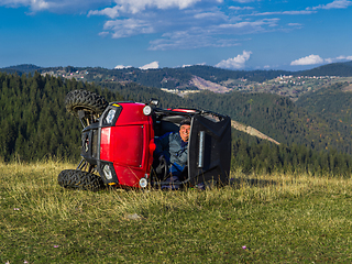 Image showing Accident on an adventure quad bike ride. The driver crashes after driving dangerously