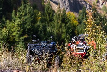 Image showing Various ATV quad motors in the forest area ready for adventurous driving