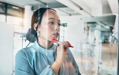 Image showing Woman at glass, thinking with ideas and pen for business planning, brainstorming or working process. Mind map, creative plan and writing on moodboard for startup proposal, agenda or workshop schedule