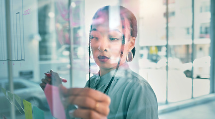 Image showing Woman at glass with mind map, pen and ideas for business planning, brainstorming and working process. Thinking, creative plan and writing on sticky note for startup proposal on moodboard for workshop