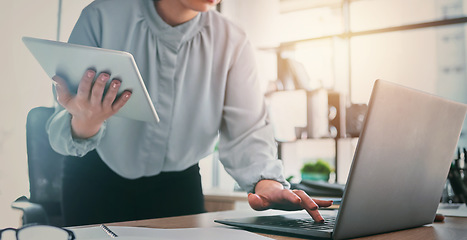 Image showing Tablet, laptop and business woman hands at web analyst company with typing. Technology, female person and online professional working in a office with computer and digital data research for project