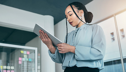 Image showing Woman in office on tablet, research and checking email with sticky note ideas on moodboard, business plan and brainstorming. Thinking, reading web and businesswoman on digital app for online review.