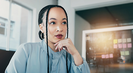 Image showing Thinking, corporate and a woman in an office workspace for planning, ideas or a business vision. Young, working and a worker, employee or girl at a company for marketing job or career solution