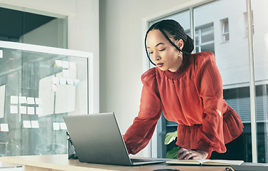 Image showing Woman in office on laptop, research and brainstorming on website for business plan, ideas or proposal process. Thinking, internet search and businesswoman on computer with online notes at startup.