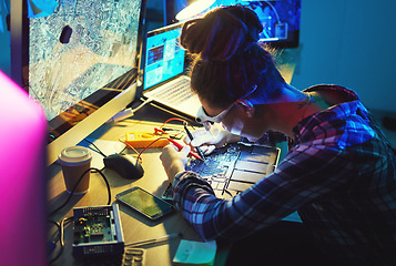 Image showing Woman, electronics technician and motherboard with soldering iron for microchip repair. Information technology, circuit board and a person programming for future hardware or system upgrade at night