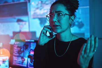 Image showing Night, angry and a woman hacker on a phone call during a cyber security emergency in her office. Communication, software problem and dark with a female programmer talking about information technology