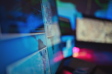 Image showing Dark, empty office and computer for cyber security, global coding or monitor. Closeup, technology abstract and a pc at night at company for programming, cloud computing or data science for the world