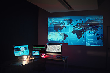 Image showing Dark, empty office and computer for global research or monitor of a system. Closeup, technology abstract and a pc at night at company for programming, cloud computing or data science for the world