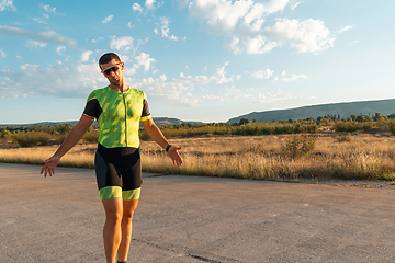 Image showing A triathlete resting after a hard morning's run. Training preparation for the upcoming marathon