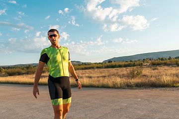 Image showing A triathlete resting after a hard morning's run. Training preparation for the upcoming marathon