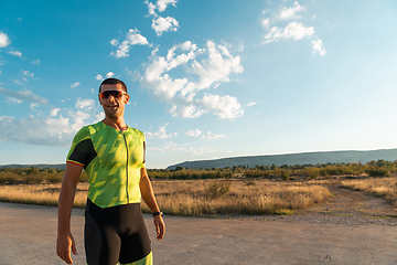 Image showing A triathlete resting after a hard morning's run. Training preparation for the upcoming marathon