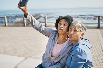 Image showing Senior fitness, selfie and women at the beach for workout, wellness and morning cardio in nature. Healthy retirement, social media and friends at sea for profile picture, photo or exercise memory