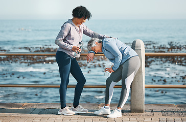 Image showing Tired, running and senior friends by the ocean for fitness, exercise and workout. Runner, mature people with sport outdoor on a beach promenade path together for wellness and health on a break