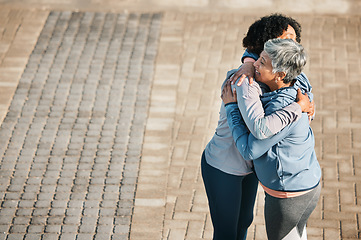 Image showing Running, hug and women with mockup space, love and care for fitness and exercise. Athlete, wellness and female friends on a promenade with motivation, greeting embrace and smile from runner target