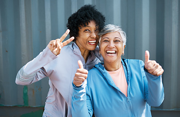 Image showing Mature, women and friends, portrait and fitness, peace hand gesture with thumbs up pose and playful outdoor. Female people, friendship and cool in sportswear, exercise and fun together with wellness