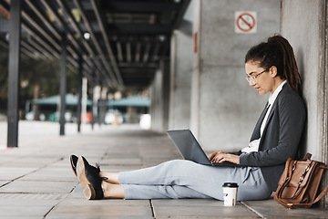 Image showing Typing, laptop and woman on a coffee break in the city or employee on social media, job search or online hiring opportunity. Unemployed, worker and networking on computer in town for business