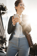 Image showing Employee, city and woman with a smartphone, smile and email with internet connection, social media and lens flare. Worker, travel or business person with a cellphone, mobile app or sms with happiness