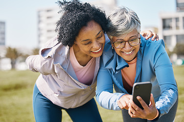 Image showing Senior woman, friends and outdoor with phone or social media, blog or reading post about workout, exercise and walk in park. Elderly person, people and check profile picture together on screen