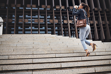 Image showing Business woman, stairs and coffee break in city with work commute, drinking and worker. Urban town, female lawyer back and steps to company with travel and professional in morning with employee