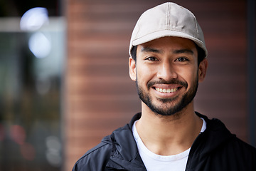 Image showing Courier man, outdoor headshot and portrait for service, delivery or smile for supply chain job. Young logistics worker, face and city for customer satisfaction, mockup space or ecommerce in metro cbd