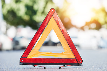 Image showing Red triangle, road sign and stop for emergency, construction or symbol for caution to driver on the ground, floor or street. Attention, warning and signal to traffic of an accident or problem