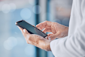 Image showing Person, doctor and hands with phone for communication, healthcare or Telehealth at hospital. Closeup of medical professional or nurse on mobile smartphone app for networking or social media at clinic