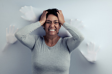 Image showing Portrait, screaming and senior woman with anxiety, depression and trauma with mental health. Angry face, female person or model with stress, frustrated and psychology with fear on a studio background