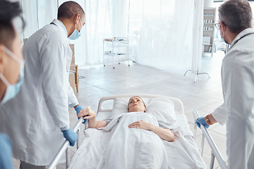 Image showing Doctors, theater and push woman in bed for emergency surgery for cancer treatment. Medical professional, team or surgeon rush patient to operation, er or hospital clinic to save a life for healthcare