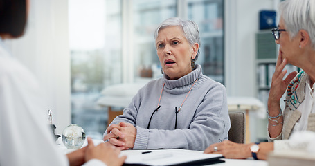 Image showing Healthcare, cancer or bad news with a senior woman and friend talking to a doctor in the hospital. Medical, support and diagnosis with a medicine professional consulting a patient in the clinic