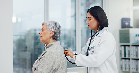 Image showing Senior woman, doctor and stethoscope on back to listen to lungs for breathing problem. Elderly, medical professional and person with cardiology tools for exam, consultation or healthcare in hospital