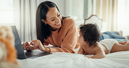 Image showing Love, laptop and mother with baby in a bed for bonding, relax and playing in their home. Family, social media and female mom influencer with newborn in a bedroom and content creation for online blog