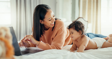 Image showing Remote work, love and mother with baby in a bed for bonding, relax and playing in their home. Work from home, freelance and female relax with newborn, happy and smile while having fun in a bedroom