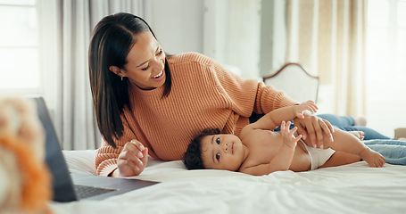 Image showing Remote work, love and mother with baby in a bed for bonding, relax and playing in their home. Work from home, freelance and female relax with newborn, happy and smile while having fun in a bedroom