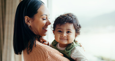 Image showing Love, happy and mother with baby at window for play, relax and quality time. Happiness, smile and health with a woman and newborn infant in family home apartment for care, security and bonding