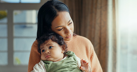 Image showing Love, mom holding baby in home and bonding with care and hug, holding hands and rocking to calm child. New mother with newborn and safety and support from woman thinking of future comfort in house.