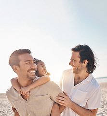 Image showing Funny, piggyback and lgbt family at beach for love, care and a vacation in summer. Smile, interracial and gay parents laughing with child at sea during a holiday for bonding, travel or mockup space
