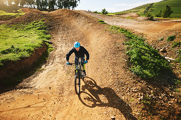 Image showing Cycling, sports and man in nature on bicycle for adrenaline on adventure, freedom and speed. Mountain bike, countryside and cyclist for training, exercise and fitness on dirt road, trail and track