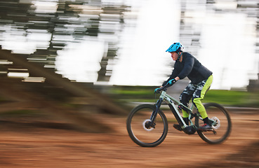 Image showing Bike, man and speed with motion blur in forest for sport, race or adventure in summer, woods or nature. Extreme fast cycling, person and action on trail, workout or challenge for fitness with freedom