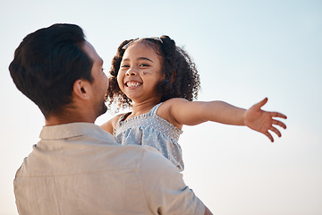 Image showing Family, airplane and girl with dad at a beach happy, smile and having fun on summer vacation. Love, hug and excited child with father in nature for adventure, travel and bond, flying and freedom