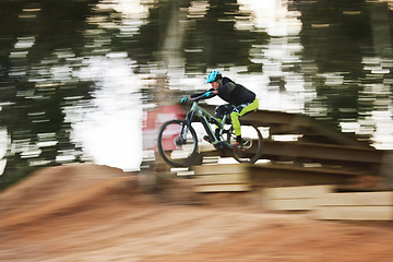 Image showing Cycling, sports and person with blur on bicycle for adrenaline on adventure, freedom and speed. Mountain bike action, fast and cyclist for training, exercise and fitness on dirt road, trail and track