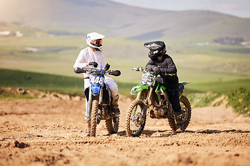 Image showing Friends, sports and men with motorcycle in countryside for fun, hobby and Moto stunt training, practice or freedom. Off road, motorbike and biker people in nature for adrenaline, challenge or race