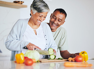 Image showing Love, health and cooking with old couple in kitchen for food, lunch and helping. Wellness, nutrition and diet with senior man and woman cutting vegetables at home for retirement, dinner and relax