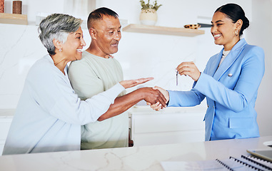 Image showing Happy senior couple, realtor and keys to new home in handshake for mortgage, property or investment. Excited elderly man and woman shaking hands for real estate retirement, house payment or purchase