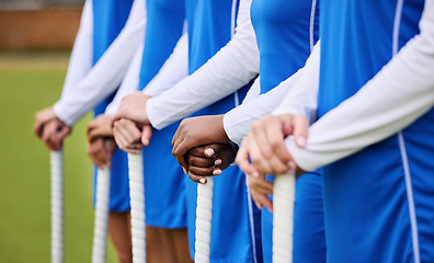 Image showing Teamwork, sports and hockey with hands of people on field for workout, challenge and support. Fitness, competition and training with closeup of women at tournament for health, community and exercise