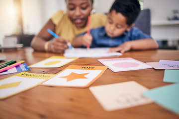 Image showing Child, homework help and study card in home with shapes teaching for development growth. Young boy, mom support and school work for education and coloring at a house for kindergarten at the table